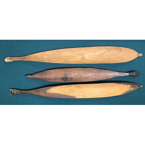 522 - THREE ABORIGINAL WOOMERA. Three Aboriginal Woomera spear throwers, all with fibre bound points, two ... 