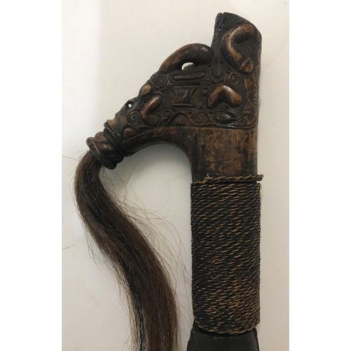 531 - BORNEO HEAD HUNTERS SWORD AND SCABBARD. An unusual Head Hunters Sword (mandau) with elaborate carved... 