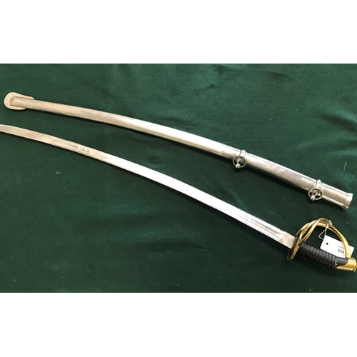 534 - A REPRODUCTION CAVALRY OFFICERS SWORD. A reproduction sword with an 87cm curved blade with double fu... 