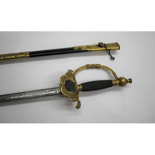 543 - CEREMONIAL SWORD - C SMITH & CO with a brass hilt and twisted wire grip, the guard with a Thistle mo... 