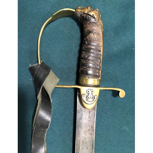 555 - A 19TH CENTURY HANGER. A 19th century brass stirrup hilted hanger with curved 72cm single edged blad... 