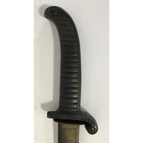 557 - AN UNUSUAL SWORD WITH CAST IRON HANDLE. A sword with a curving 77cm blade with allover scrolling and... 