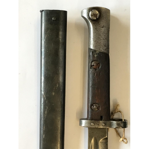 596 - A CZECHOSLOVAKIAN BAYONET AND SCABBARD. A First World War period Chechoslovakian bayonet with a 29.5... 