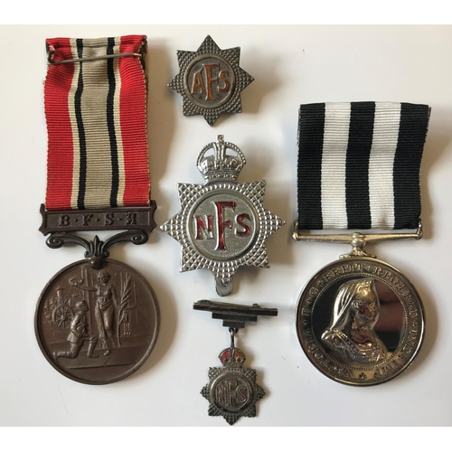 880 - A BRITISH FIRE ASSOCIATION LONG SERVICE MEDAL AND OTHERS. A bronze British Fire Association long ser... 