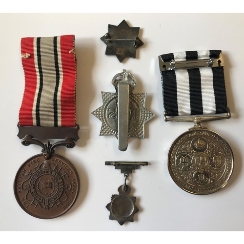 880 - A BRITISH FIRE ASSOCIATION LONG SERVICE MEDAL AND OTHERS. A bronze British Fire Association long ser... 