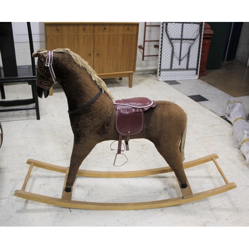 1376 - MODERN ROCKING HORSE by Davies of Liverpool, the horse fitted with saddle and bridle. On a wooden ro... 