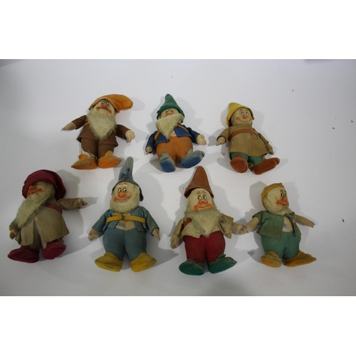 1411 - CHAD VALLEY - SEVEN DWARFS a collection of 7 Chad Valley Dwarfs, each figure with a hat. Each figure... 