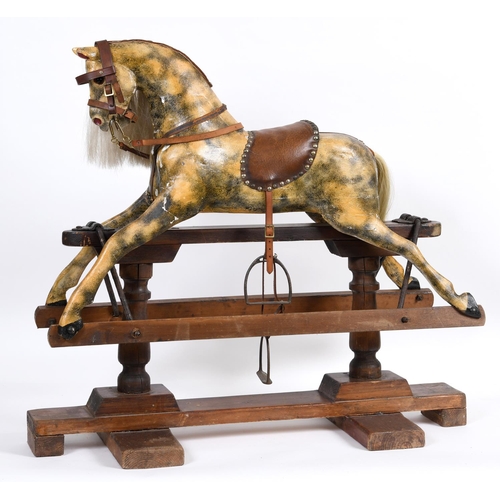 1416 - ANTIQUE ROCKING HORSE a small painted wooden rocking horse, mounted on a pine treadle base. Fitted w... 