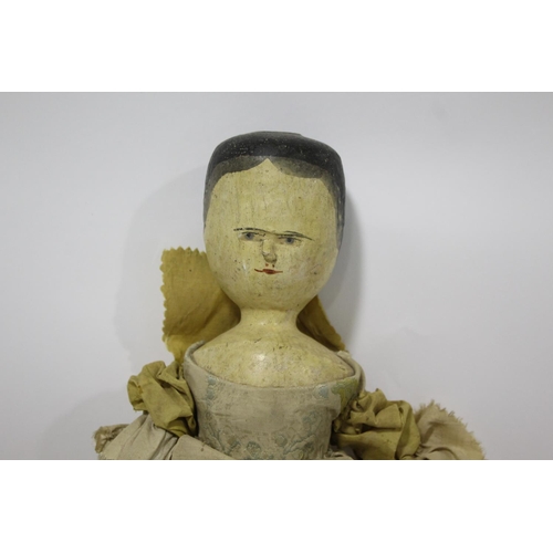 1476 - LARGE 19THC WOODEN DOLL a large peg jointed wooden doll with articulated limbs and probably with its... 