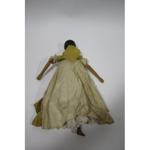 1476 - LARGE 19THC WOODEN DOLL a large peg jointed wooden doll with articulated limbs and probably with its... 