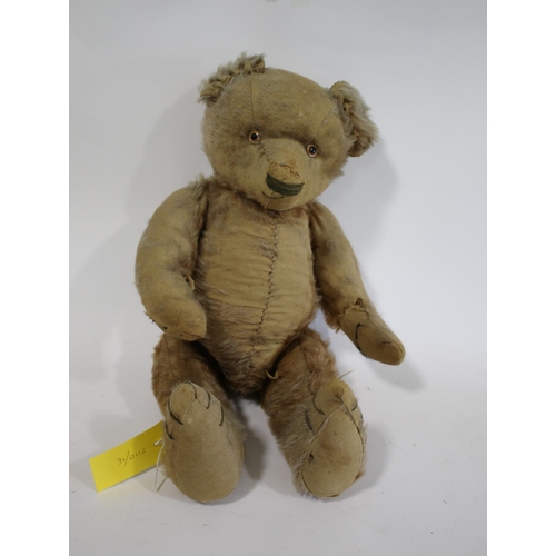 1484 - VINTAGE TEDDY BEAR a large vintage Bear with the remains of a cinnamon coloured mohair body, with a ... 