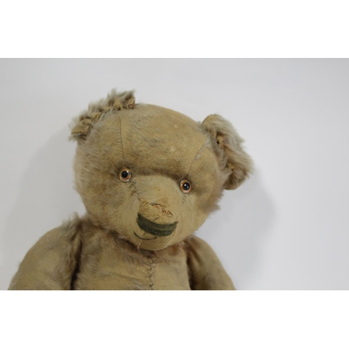 1484 - VINTAGE TEDDY BEAR a large vintage Bear with the remains of a cinnamon coloured mohair body, with a ... 