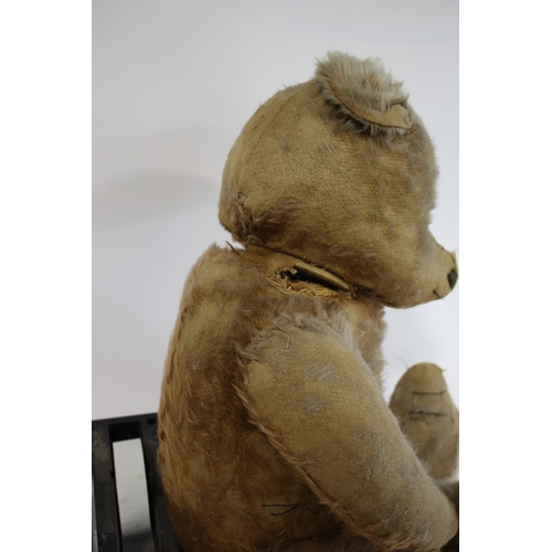 1484 - VINTAGE TEDDY BEAR a large vintage Bear with the remains of a cinnamon coloured mohair body, with a ... 