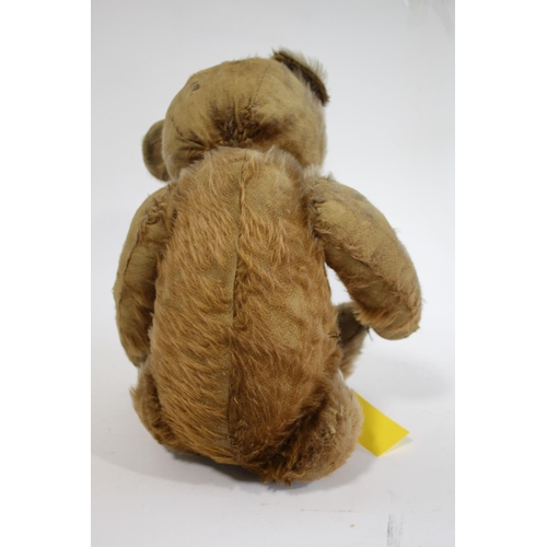 1484 - VINTAGE TEDDY BEAR a large vintage Bear with the remains of a cinnamon coloured mohair body, with a ... 