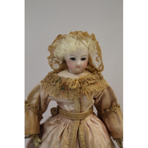 1506 - 19THC FRENCH FASHION DOLL a French Barrois type fashion doll circa 1860, with a bisque swivel head a... 