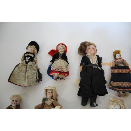 1511 - COLLECTION OF MINIATURE DOLLS a collection of miniature dolls including bisque head, parian, and chi... 