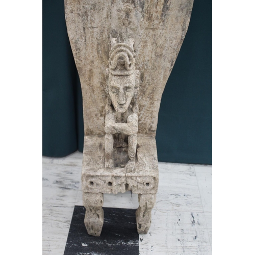 1539 - TIMOR TRIBAL FIGURE with a figure seated on a large chair or throne, with carved decoration to the t... 