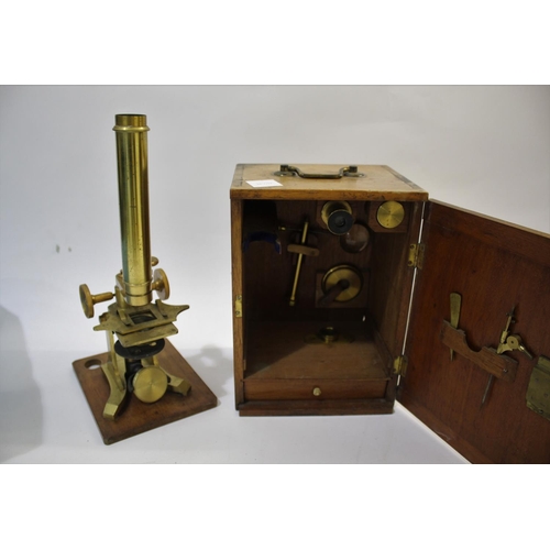 1574 - CASED MICROSCOPE - THE INTERNATIONAL probably by M Pillischer, the brass monocular microscope on a w... 