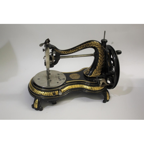 1584 - 19THC CAST IRON SEWING MACHINE - JONES a 19thc cast iron base sewing machine, hand crank and with va... 