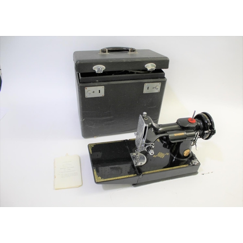 1641 - SINGER SEWING MACHINE - 221K a folding portable Singer 221K sewing machine, in its case and with it'... 