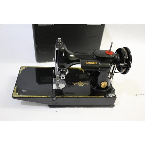 1641 - SINGER SEWING MACHINE - 221K a folding portable Singer 221K sewing machine, in its case and with it'... 