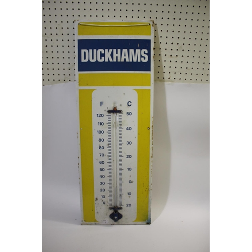 1644 - DUCKHAMS ENAMEL SIGN a large enamel sign with attached thermometer (thermometer damaged), with measu... 