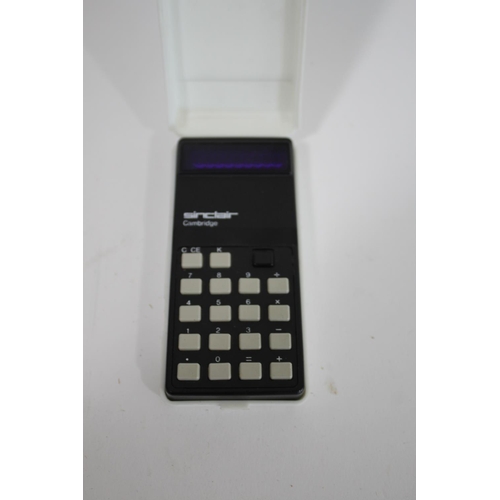 1676 - SINCLAIR POCKET TELEVISION & CALCULATOR a Sinclair MTV 1A Pocket Television, in its original case an... 