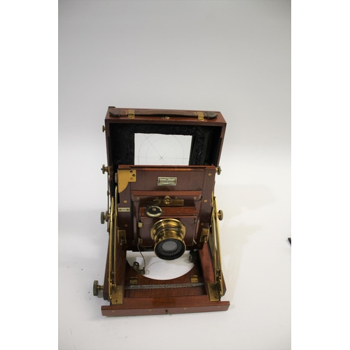 1702 - SANDERSON PLATE CAMERA a mahogany plate camera with a Beck Symmetrical Lens (leather cap with paper ... 