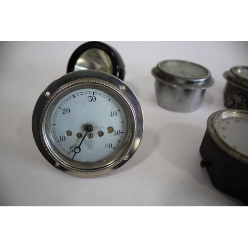 1703 - SMITHS VINTAGE MOTORING CAR CLOCK with a silver colour dial and aperture for mileage (A-532.119), wi... 