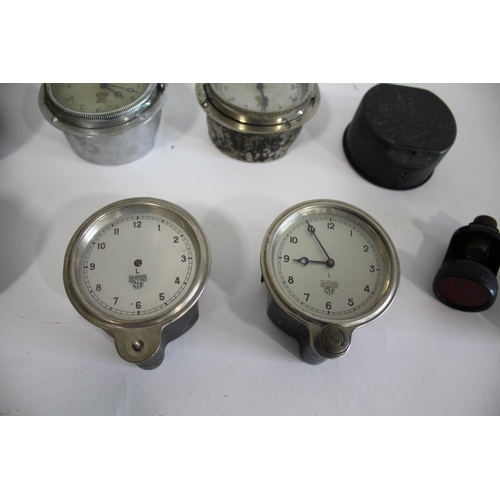 1703 - SMITHS VINTAGE MOTORING CAR CLOCK with a silver colour dial and aperture for mileage (A-532.119), wi... 