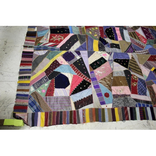 1755 - CRAZY PATCHWORK QUILT - AMERICAN a large patchwork quilt, the centre with a large selection of silk ... 