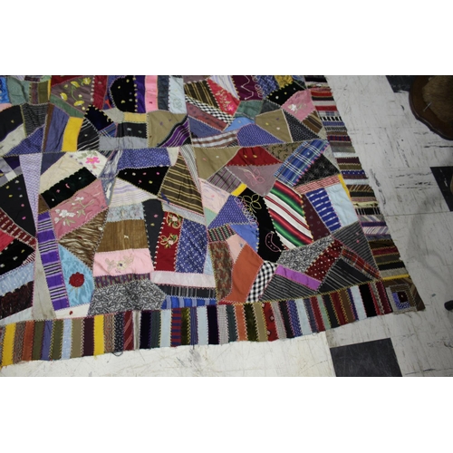 1755 - CRAZY PATCHWORK QUILT - AMERICAN a large patchwork quilt, the centre with a large selection of silk ... 