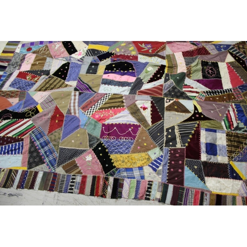 1755 - CRAZY PATCHWORK QUILT - AMERICAN a large patchwork quilt, the centre with a large selection of silk ... 