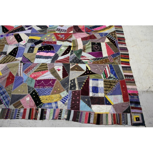 1755 - CRAZY PATCHWORK QUILT - AMERICAN a large patchwork quilt, the centre with a large selection of silk ... 