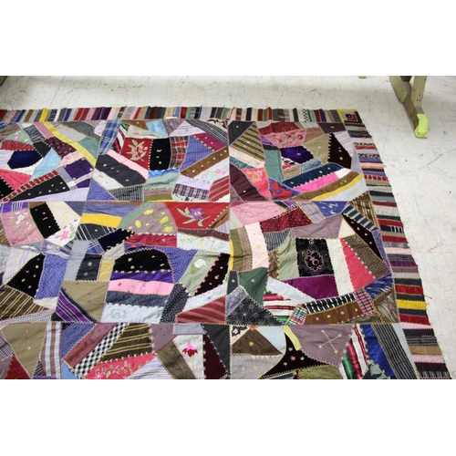 1755 - CRAZY PATCHWORK QUILT - AMERICAN a large patchwork quilt, the centre with a large selection of silk ... 