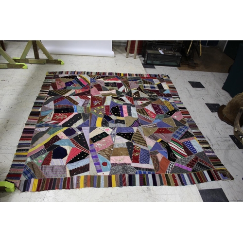 1755 - CRAZY PATCHWORK QUILT - AMERICAN a large patchwork quilt, the centre with a large selection of silk ... 