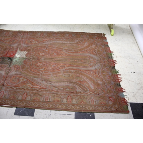 1757 - 19THC PAISLEY SHAWL probably late 19thc, a large Paisley patterned woollen shawl with the remains of... 