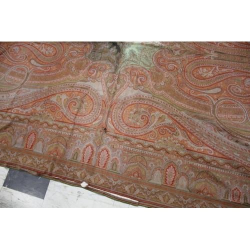 1757 - 19THC PAISLEY SHAWL probably late 19thc, a large Paisley patterned woollen shawl with the remains of... 