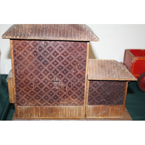 1466 - JAPANESE DOLLS HOUSE an early 20thc wood and wicker Japanese dolls house on stand, with an attached ... 