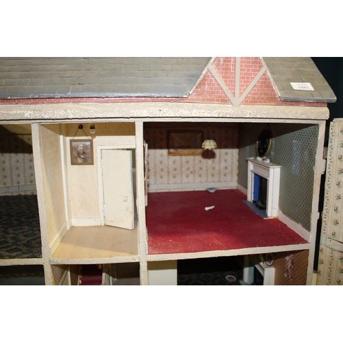 1481 - ANTIQUE DOLLS HOUSE a 2 storey house with large glazed windows and brick facade, the interior with f... 