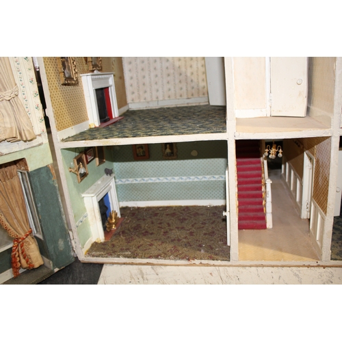 1481 - ANTIQUE DOLLS HOUSE a 2 storey house with large glazed windows and brick facade, the interior with f... 