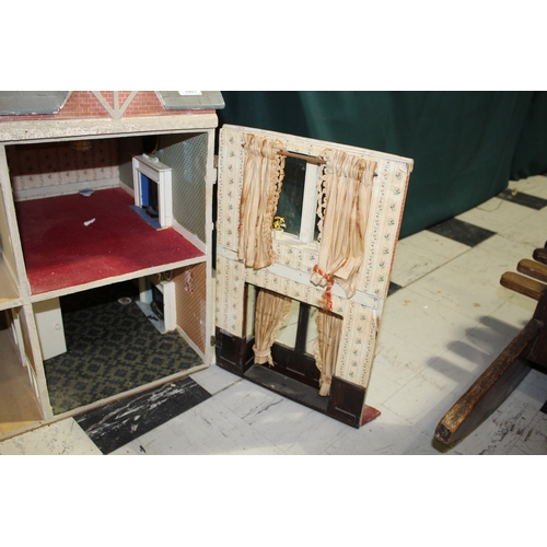 1481 - ANTIQUE DOLLS HOUSE a 2 storey house with large glazed windows and brick facade, the interior with f... 