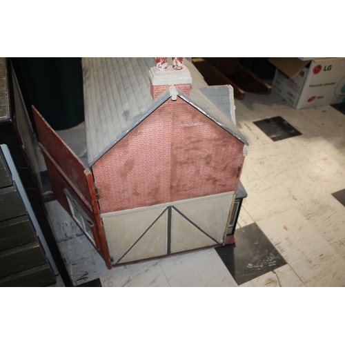 1481 - ANTIQUE DOLLS HOUSE a 2 storey house with large glazed windows and brick facade, the interior with f... 