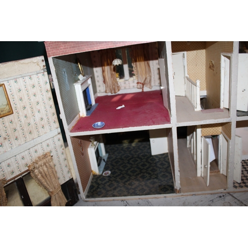 1481 - ANTIQUE DOLLS HOUSE a 2 storey house with large glazed windows and brick facade, the interior with f... 