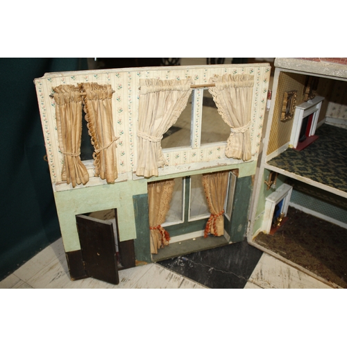 1481 - ANTIQUE DOLLS HOUSE a 2 storey house with large glazed windows and brick facade, the interior with f... 