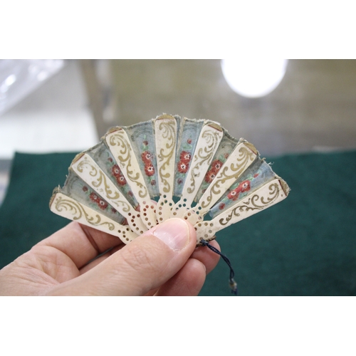 1505 - 19THC DOLLS FAN a fabric and bone miniature fan, with pierced bone brise sections with gold painted ... 