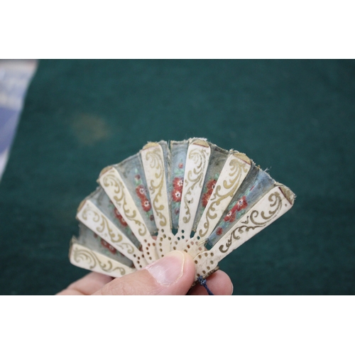 1505 - 19THC DOLLS FAN a fabric and bone miniature fan, with pierced bone brise sections with gold painted ... 