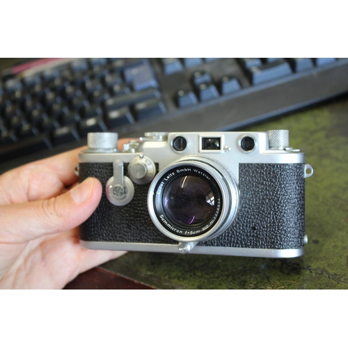 1681 - LEICA CASED CAMERA a Leica IIIf rangefinder camera, Serial Number 687691 (1954) and with a Leitz Sum... 