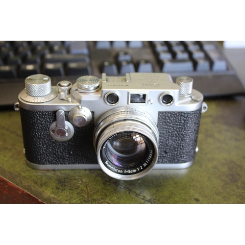 1681 - LEICA CASED CAMERA a Leica IIIf rangefinder camera, Serial Number 687691 (1954) and with a Leitz Sum... 