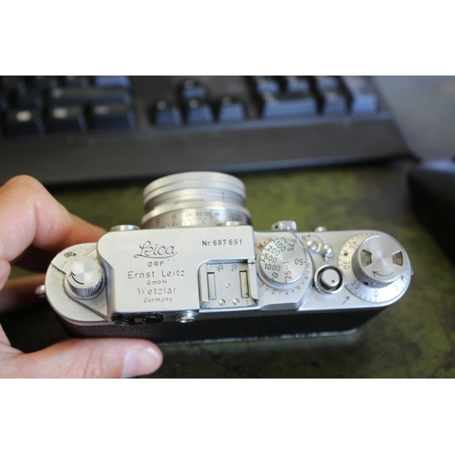 1681 - LEICA CASED CAMERA a Leica IIIf rangefinder camera, Serial Number 687691 (1954) and with a Leitz Sum... 